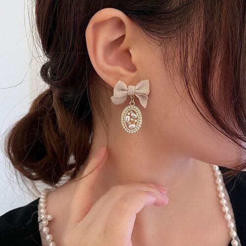 Beige Fabric Bow And Pearls Beaded Oval Drop Earrings