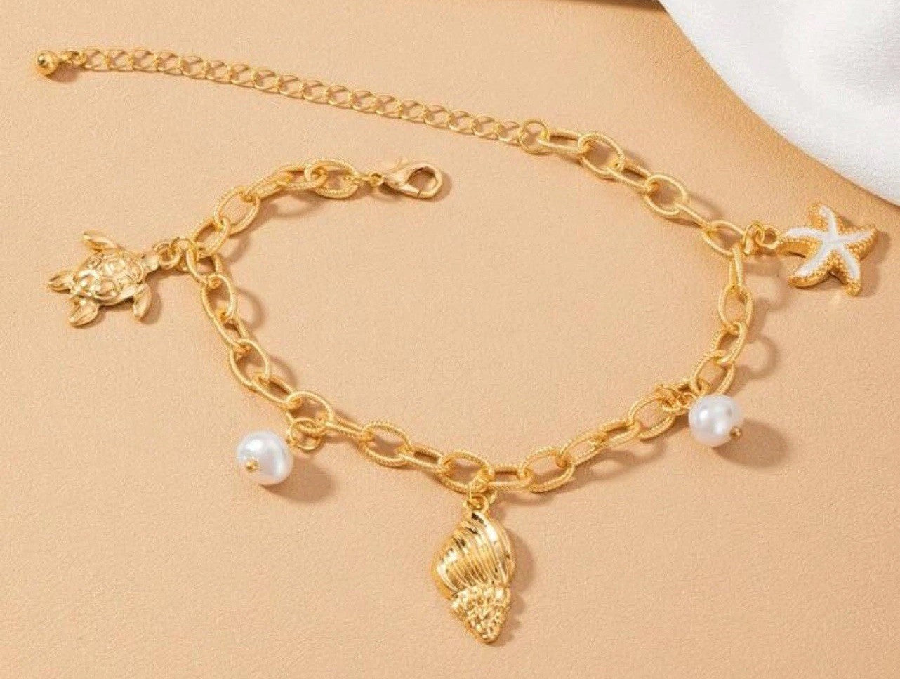 Gold Stainless Steel Pearls And Beach Charms Bracelet0