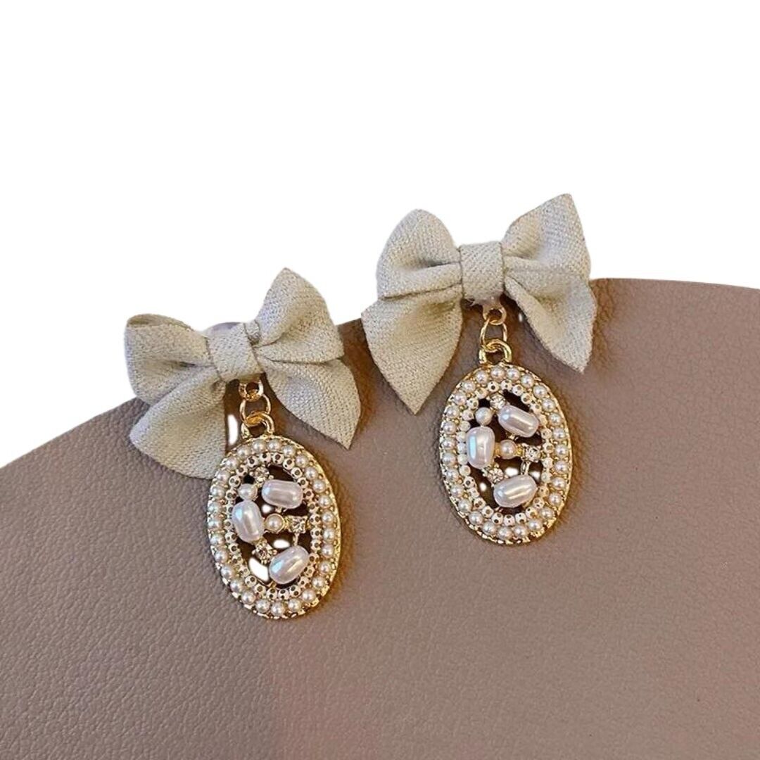 Beige Fabric Bow And Pearls Beaded Oval Drop Earrings